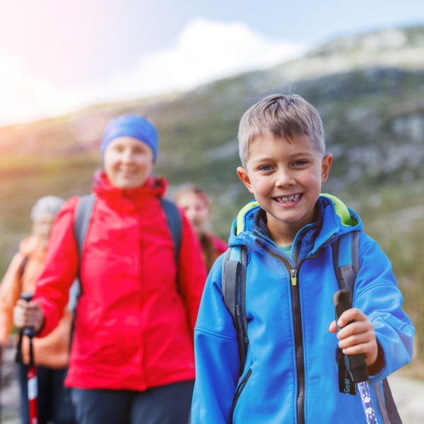 hiking-poles-for-kids-with-family-on-the-background