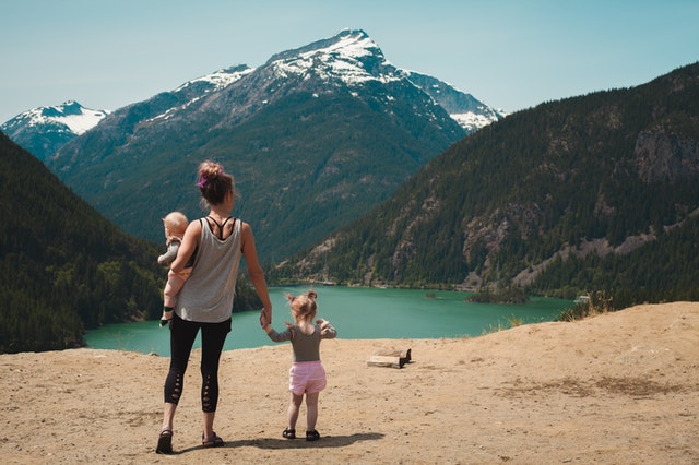 mom-with-daughters-hiking-with-beautiful-view