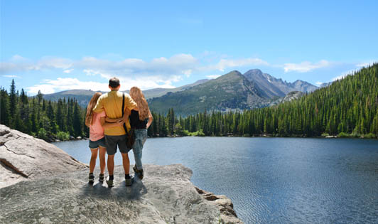 family-together-with-beautiful-nature-background